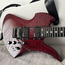 Elektrická kytara s červeným lakovaným povrchem s viditnou strukturou dřeva. Na snímačích je uveden nápis RockField a na kobylce nápis FloyD Rose. Ky…