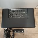 Černý kytarový kombo zesilovač s texturovaným povrchem. Na zadním panelu je nápis VOX MINI GO 50 a řada ovládacích prvků v sekcích INPUT, AMP, EFFECT…