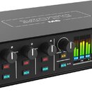 Černý audio rozhraní s nápisem MOTU M6 na horní straně. Přední panel obsahuje čtyři ovratové knoflíky s označením GAIN (čísla 1 až 4), přepínače 48V…