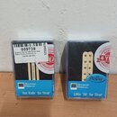 Dvě krabičky s elektrickými snímači značky Seymour Duncan. Levá krabička obsahuje krémový snímač s nápisem Hot Rails™ for Strat® a štítkem, na kterém…