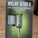 Fotografie znázorňuje originální kartónové balení bezobalového bezdrátového vysílače. Na obalu je nápis RELAY G10TII DIGITAL INSTRUMENT WIRELESS TRAN…