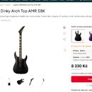 Černá elektrická kytara s tvarem Superstrat a špičatou hlavou. Na těle jsou dva humbuckery a Floyd Rose tremolo systém. V textu nad obrázkem je uvede…