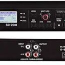 Dvě fotografie černého rackového zařízení značky TASCAM, model SD-20M. Přední panel obsahuje displej, ovládací tlačítka, dva vstupy ANALOG INPUT (BAL…