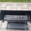 Zadní strana černého komba v otevřeném přepravním pouzdře. Na panelu jsou viditelné konektory a nápisy: GLOCKENKLANG Soul, Poweramp, Reverb, Loop Sen…