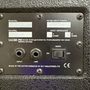 Záběr na zadní panel černého reproduktoru s dvěma konektory INPUT a LINK. Na panelu jsou nápisy Model No; RBCL40126, Serial No; (ručně psaný nečiteln…