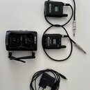 Sada bezdrátového systému Line 6 Relay G10 v černé barvě. Obsahuje přijímač s nápisem RELAY G10 a dvěma anténami, dva vysílače s logem LINE 6 a displ…