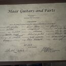 Fotografie zobrazuje certifikát specifikací od Haar Guitars and Parts. Dokument obsahuje ručně vyplněné údaje o kytáře, včetně modelu St. classic, tě…