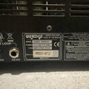 Záhlaví černého kytarového zesilovače s dvěma konektory FX LOOP označenými jako RETURN a SEND. Na štítku je uvedena značka ORANGE LONDON ENGLAND VOIC…