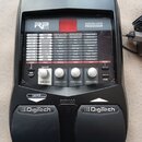 Černý kytarový procesor s nápisem MODELING GUITAR PROCESSOR a logem RP 155. Zařízení obsahuje ovládací panel s tabulkou parametrů, několika tlačítky…