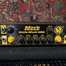 Černý basový zesilovač s nápisem Markbass Little Mark 58R. Přední panel obsahuje žluté ovládací knoflíky Gain a Master, několik černých knoflíků pro…