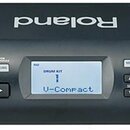 Černý elektronický perkusní modul s displejem a ovládacími prvky. Na levé straně je nápis Roland TD-4 PERCUSSION SOUND MODULE a tlačítka POWER, TUNIN…