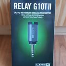 Fotografie znázorňuje originální krabici s bezdrátovým vysílačem. Na krabici je velký bílý nápis RELAY G10TII a text DIGITAL INSTRUMENT WIRELESS TRAN…