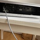 Zadní strana kytarového zesilovače v bílém rámu. Na černém zadním panelu je nápis Mesa Boogie a nadpis AUDIO PREAMP. Jsou zde sekce EFFECTS LOOP, SIG…