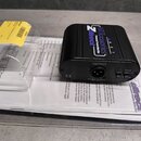Černý DI box značky ART s nápisem ARTcessories a Zdirect Professional Passive Direct Box. Na spodní straně je vidět výstup OUTPUT, přepínač PHASE (LI…