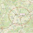 Fotografie zobrazuje mapu části České republiky s červeným kruhem v oblasti kolem Olomouce. Uvnitř kruhu je umístěna bílá textová bublina s nápisem Z…