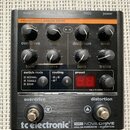 Černý kytarový efekt s nápisem tc electronic a modelem NDR-1 NOVA DRIVE ANALOG OVERDRIVE + DISTORTION. Zařízení má osm otočných knoflíků s popisky ov…