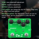 Zelený efekt pedál s nápisem OVERDRIVE a logem Dr. J. Na horní straně jsou tři černé otočné knoflíky s popisky TONE, OUTPUT a DRIVE. Vedle nich se na…