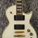 Bílá elektrická kytara s gold hardwarem a hnědým hmatníkem. Na hmatníku je viditelný nápis EC-401. Kytara má dva humbuckery, tři otočné knoflíky a je…