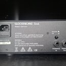 Zadní strana černého elektronického zařízení s nápisem GLOCKENKLANG Soul a Made in Germany. Jsou zde vidět konektory s popisky DI Out, Ground Lift, P…