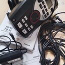 Černý elektronický bicí modul značky Roland. Na přední straně jsou viditelné nápisy TD-15 a TD-11 DRUM SOUND MODULE, ovládací tlačítka a displej. Sou…