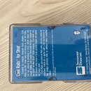Plastové průhledné pouzdro s modrým vnitřním papírem. Na papíře je bílý nápis Cool Rails™ for Strat a logo Seymour Duncan. Text popisuje vlastnosti s…
