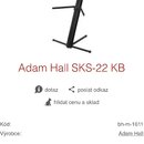 Fotografie znázorňuje černý kovový stojan na hudební nástroje s několika rameny. Pod obrázkem je uveden název modelu Adam Hall SKS-22 KB a u výrobce…