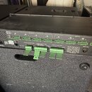 Černý rackový přístroj s nápisem RPM 88 a označením "REMOTE CONTROL UNIT". Zadní panel obsahuje řadu zelených svorkovnic s popisky OUTPUTS a INPUTS,…
