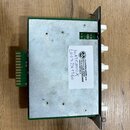 Elektronický modul v zeleném plošníkovém rámu s kovovým krytem. Na bílé nálepce je logo v kruhu a text SALVATION MODS s.r.o., 370 u ČESKÉ BUDĚJOVICE,…
