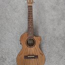 Akustický basový ukulele v dřevěném provedení s výřezem u krku. Na hlavě je nápis LANIKAI a uvnitř otvaru těla se nachází štítek s nápisem Lanikai HA…