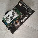 Elektronický modul zesilovače značky Randall AMPLIFIERS USA. Na bílém chladiči je nápis PLENI 050HE1015 a na zelené desce označení 0304E/1. Modul má…