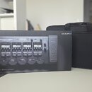 Krabice s nápisem ZOOM G5n Multi-Effects Processor a doprovodný černý polstrovaný pouzdro. Na krabici je vidět obrázek efektového procesoru a modrý š…
