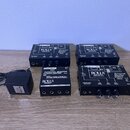 Na fotografii jsou čtyři černé kovové boxy s ovládacími prvky a konektory. Tři z nich mají nápisy ROLL'S MADE IN USA, www.rolls.com a Personal Monito…
