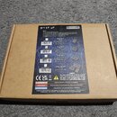 Kartonová krabice s produktem značky ROCKBOARD. Na povrchu je nápis STEP UP a seznam vlastností produktu spolu s tabulkou variant Step Up 1, Step Up…