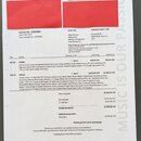 Fotografie zobrazuje fakturu od společnosti th.mann s číslem Invoice Nr.: 82683982 ze dne 10.07.2025. Dokument obsahuje položky Richter Guitar Strap…