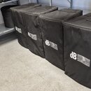 Pět černých transportních krytů z látky, které jsou umístěny v řadě na podlaze a polici. Na každém krytu je bílý nápis dB TECHNOLOGIES. Povrch látky…