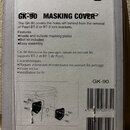 Kartonové balení příslušenství s nápisem GK-90 MASKING COVER. Text na obalu uvádí, že krytky slouží k zakrytí otvorů po odstranění držáků Pearl BT-2…