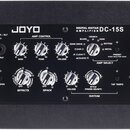 Černý digitální kytarový zesilovač s nápisem JOYO DIGITAL GUITAR AMPLIFIER DC-15S. Přední panel obsahuje ovládací prvky rozdělené do sekcí AMP CONTRO…