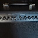 Černý kytarový kombo zesilovač s nápisem RX75RG2 75W GUITAR COMBO. Horní ovládací panel je rozdělen na sekce OVERDRIVE a CLEAN, obsahuje několik otoč…