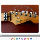 Fotografie zachycuje hlavu kytary v přírodním dřevě s nápisy Fender, STRATOCASTER a MADE IN USA. Pod logem výrobce je uvedeno sériové číslo E 956629.…