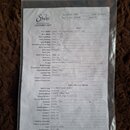 Fotografie zobrazuje papírový dokument „GUITAR SPEC SHEET CUSTOMER COPY“ značky Suhr, který je vložen v průhledném plastovém obalu. Dokument obsahuje…
