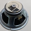 Fotografie zachycuje zadní stranu reproduktoru s kovovým rámem. Na magnetu je bílá nálepka s nápisy PROFESSIONAL LOUDSPEAKER, G12T-75 a CELESTION. Po…