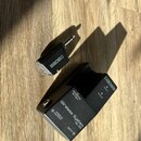 Černý bezdrátový systém značky BOSS. Na přijímači je nápis Wireless System WL-50, OUTPUT a INPUT, dále POWER a RECEIVE s kontrolkami a nápis TRANSMIT…