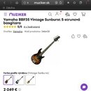 Snímek zachicuje pětistrunovou basovou kytaru v provedení Vintage Sunburst. Na hlavě nástroje je viditelné logo Yamaha. Kytara má tmavý hриф a tělo s…