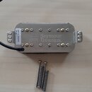 Kytarový humbucker s kovovým krytem stříbrné barvy a zlatými póly. Na krytu je nápis Seymour Duncan. Na bílé nálepce na boku jsou údaje TB-10, 13W73…