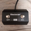 Černý obdélníkový pedál s dvěma kovovými spínači. Na horní straně je bílý nápis Blackstar®. Pod spínači jsou bílé texty CHANNEL PATCH ▼, MODE 1, MODE…
