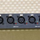 Černý rackový DMX splittery s nápisem OPTO BRANCH-4 4 Way DMX-Booster a logem Elation. Zařízení obsahuje vstup DMX IN, přepínač POWER a několik výstu…