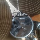 Černý ovládací modul elektronických bicích s nápisy Millenium a HD-50. Modul obsahuje displej, několik tlačítek (TEMPO/TAP, KIT, CLICK, TRIGGER, VOIC…