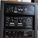 Zadní strana černého studiového subwooferu s nápisem KH 810 II AES67 ACTIVE STUDIO SUBWOOFER HIGH RESOLUTION 7.1-4 BASS MANAGER. Zařízení obsahuje di…