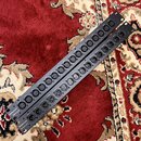 Dvě černé rackové patchpanely s řadou konektorů XLR. Na obou je v levém dolním rohu bílý nápis Millenium a pod ním označení modelu: u horního PB16-LR…