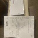Fotografie zobrazuje fakturu od společnosti thomann a uživatelský manuál k zesilovači. Na manuálu je nápis User Manual, Guitar Amp Head a logo Harley…